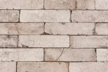 muro de pared rustica con ladrillos y macetas