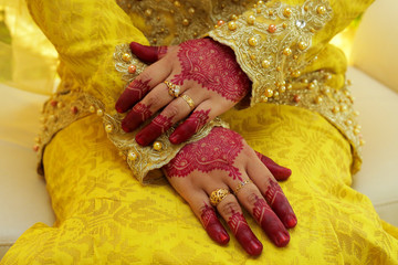 Henna Design On Women Hand. selective focus. visible noise due to high ISO.