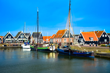 Ships and buildings in the harbor of Marken in the Netherlands