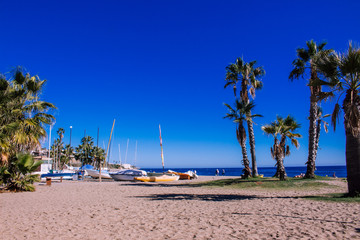Sunny day on the beach. La Cala de Mijas, Costa del Sol, Andalusia, Spain. Photo taken – 11 november 2018. - obrazy, fototapety, plakaty