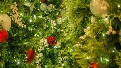 Obraz na płótnie Canvas christmas decoration on a tree, closeup, no people, merry, happy, green, red, gifts