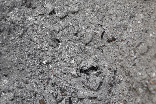 Gray ash from the oven background texture, cinder, grey ashes from the wood from the fireplace