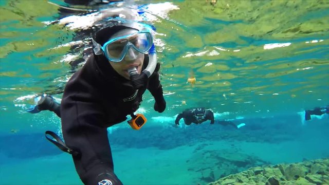 Snorkeling Silfra Fissure between the tectonic plates of North America and Europe.