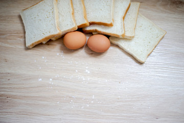 Homemade breads or bun on wood background, egg, breakfast food