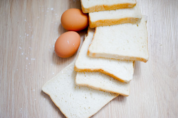 Homemade breads or bun on wood background, egg, breakfast food