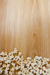 Wooden background with popcorn