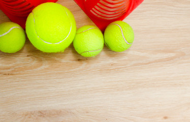 Tennis balls on  wooden background