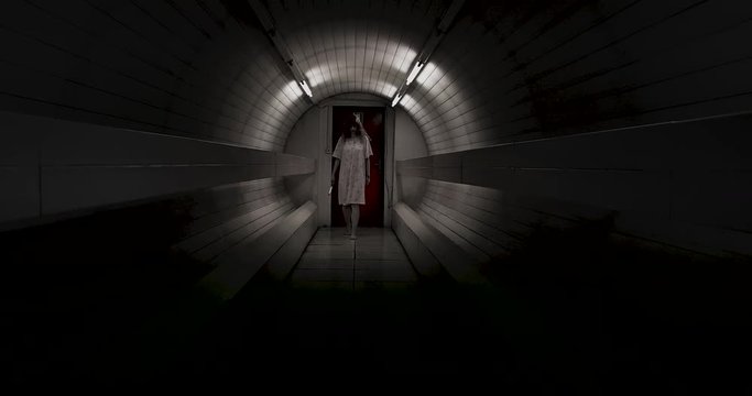 Scary zombie coming to the camera with knife