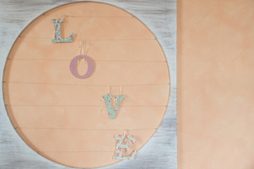 Wooden love text script with pink background