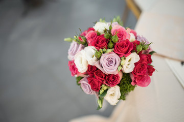 Wedding bouquet with red, rose anda white flowers