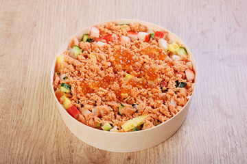 Chirashi sushi bowl with salmon, cucumber, salmon roe and sweet omelette, Japanese Food.