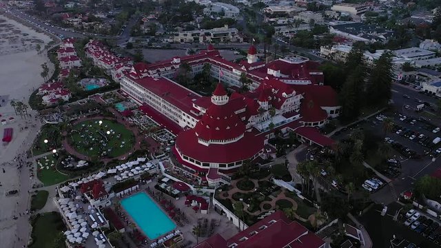 Aerial view of Hotel Del Coronado, Coronado Beach, and the Silver Stand during sunset