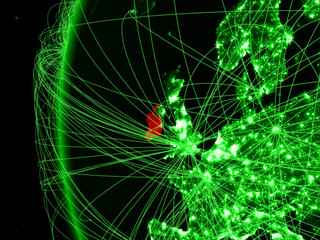 Ireland from space on green model of Earth with international networks. Concept of green communication or travel.