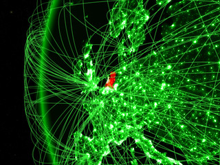 Netherlands from space on green model of Earth with international networks. Concept of green communication or travel.