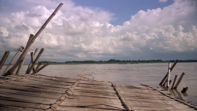 The Mekong River Rises And The Bamboo Bridge Is Broken And Separated ( Close Up) 