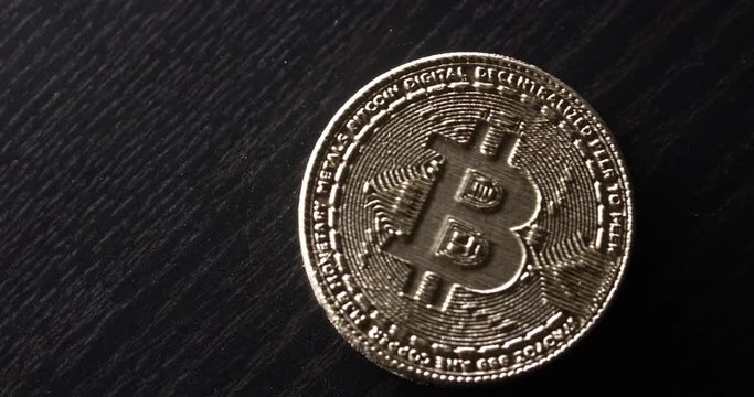 spinning Crypto currency Gold Bitcoin - BTC - Bit Coin. Macro shot from above
