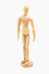 a wooden doll on a white background