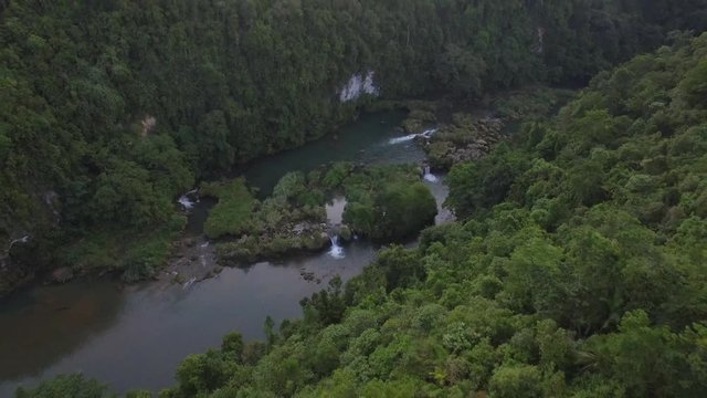 Aerial pull back shot of river rapids in Bohol Philippians