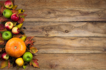 Fall background with green, red and yellow apples