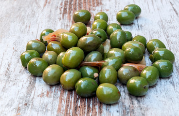 Olives surrounded by rustic background