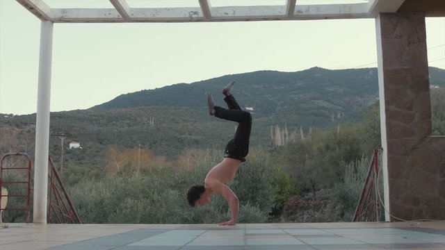 Handstand press fitness 4K in beautifully scenic location
