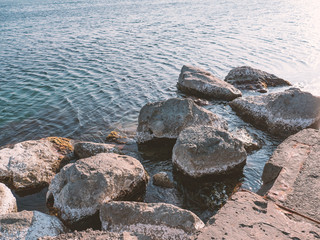 Big stones near sea beach as nature water and ocean background