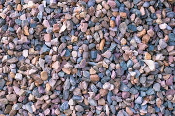 Beautiful texture of colored small stones, background of stones