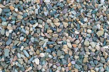 Beautiful texture of colored small stones, background of stones