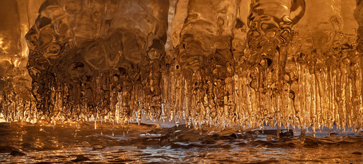 Icicles in the cave on the baikal
