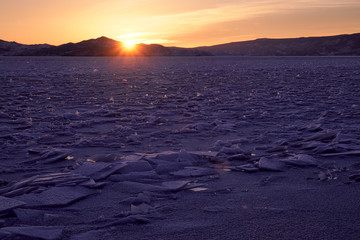 Sunset on the baikal lake in winter