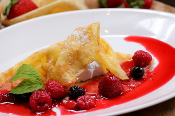 pancakes with berries and sugar