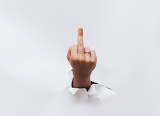 Middle finger, offensive gesture. Fuck you concept.