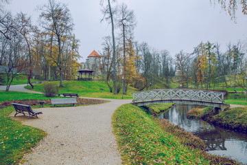 Old Casttle park at autumn. Yellow leafs, castle and architecture. Travel photo 2018.