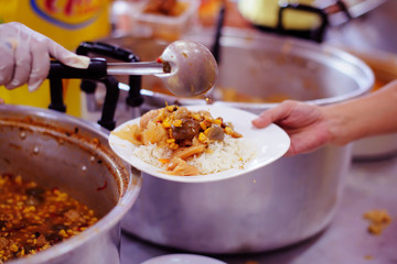Poverty in society Poor people have been donating food from the philanthropist : Concept poverty and donation