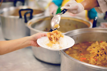 Poverty in society Poor people have been donating food from the philanthropist : Concept poverty and donation
