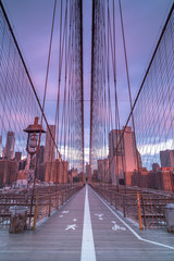 Fototapeta premium Sunrise Brooklyn bridge view from walkway, long exposure