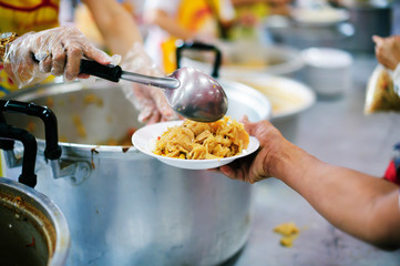 Poverty in society Poor people have been donating food from the philanthropist : Concept poverty and donation