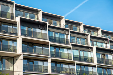 Fototapeta premium Facade of a modern housing construction with a lot of balconies seen in Berlin, Germany
