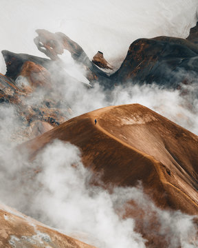 Hiker on volcanic Icelandic landscape