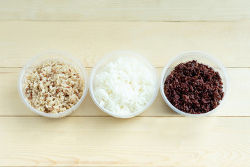 Three kinds of cooked rice in plastic bowl