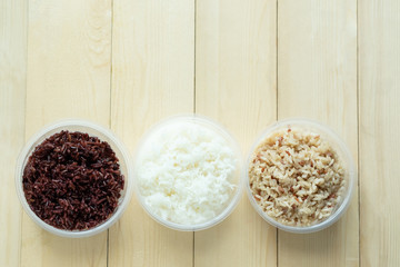 Three kinds of cooked rice in plastic bowl