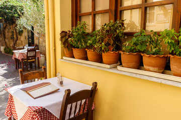 national flavor, ancient Greek streets on the island of Crete. Old houses, doors, Windows, potted plants and small outdoor cafes.