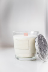 Concrete scented soy round candle on grey table