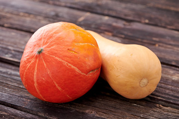 pumpkins on dark wooden background