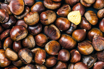 Roasted chestnuts served on an old table