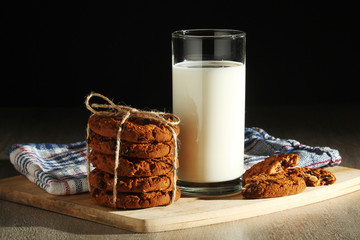 A glass with milk and chocolate cookies	