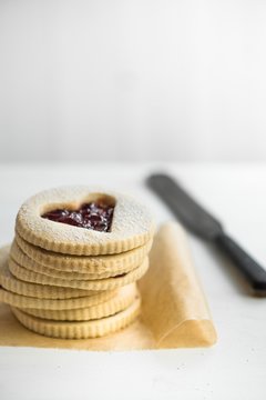 A stack of jam sandwich heart biscuits