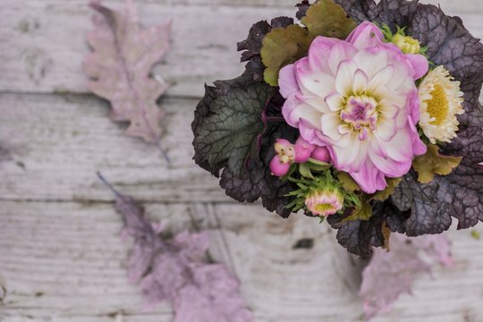 Autumnal bouquet with dahlias and ornamental leaves
