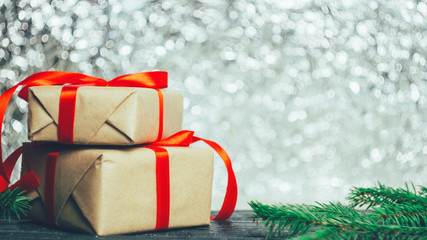 Beautifully packaged gift boxes with red ribbons for Christmas with copy space