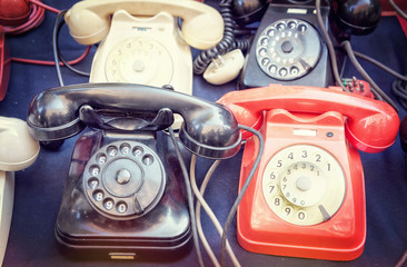 Old dialing telephones at a flea market